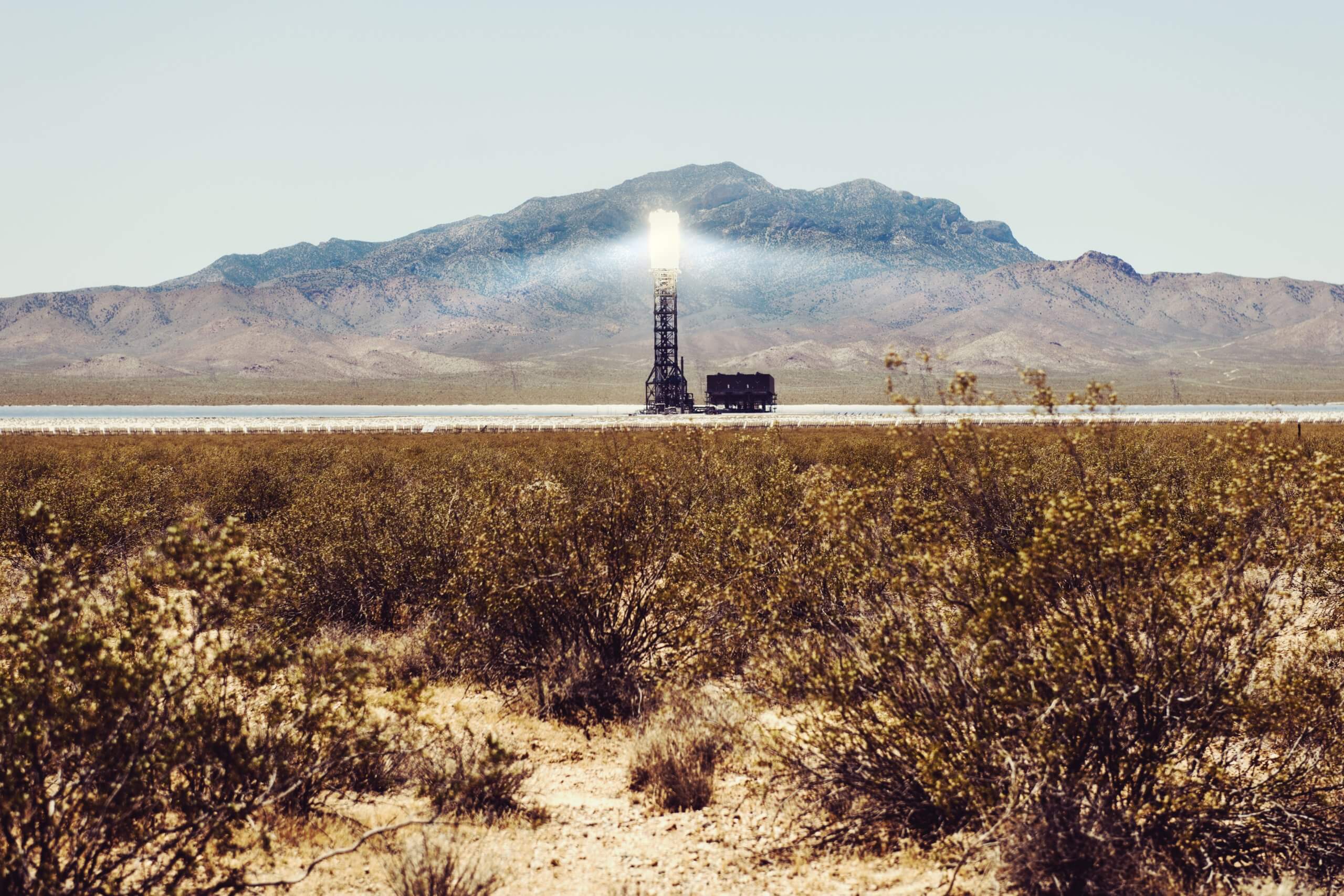 A solar thermal power plant in California under the desert sun.