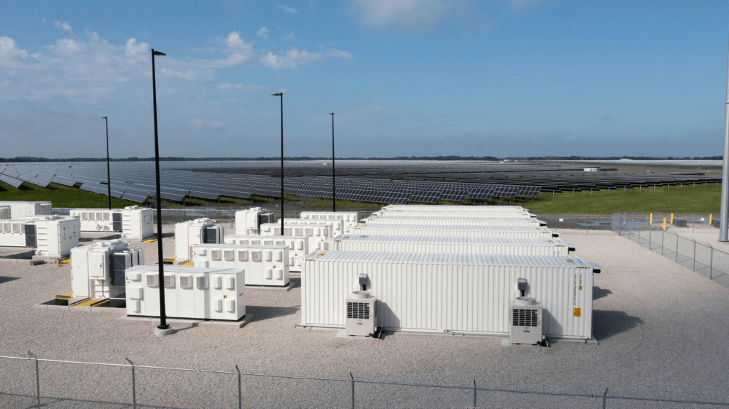 Photo of a storage plant in Texas with solar panels in the background.
